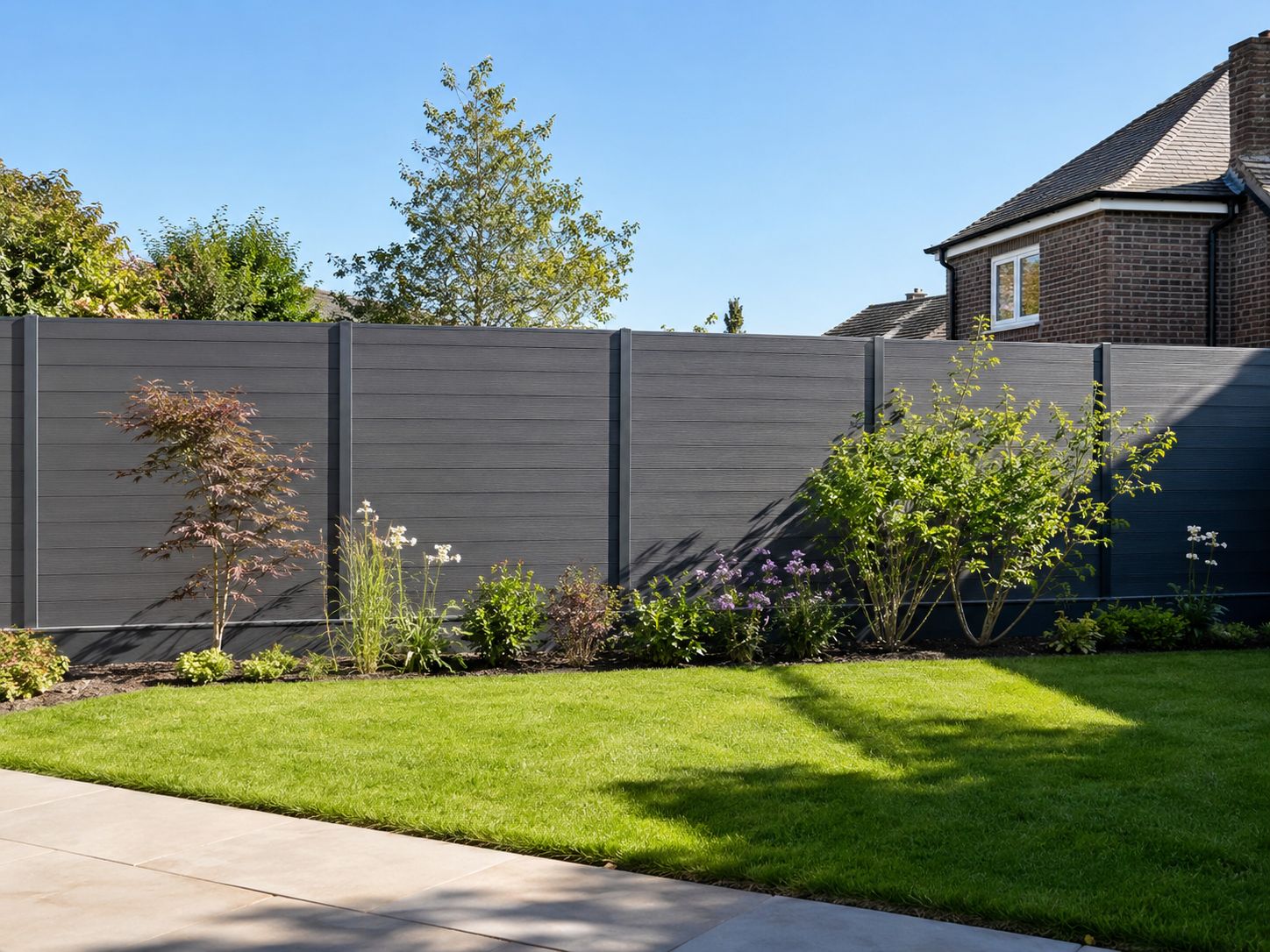 Composite fence with concrete posts in a Richmond garden