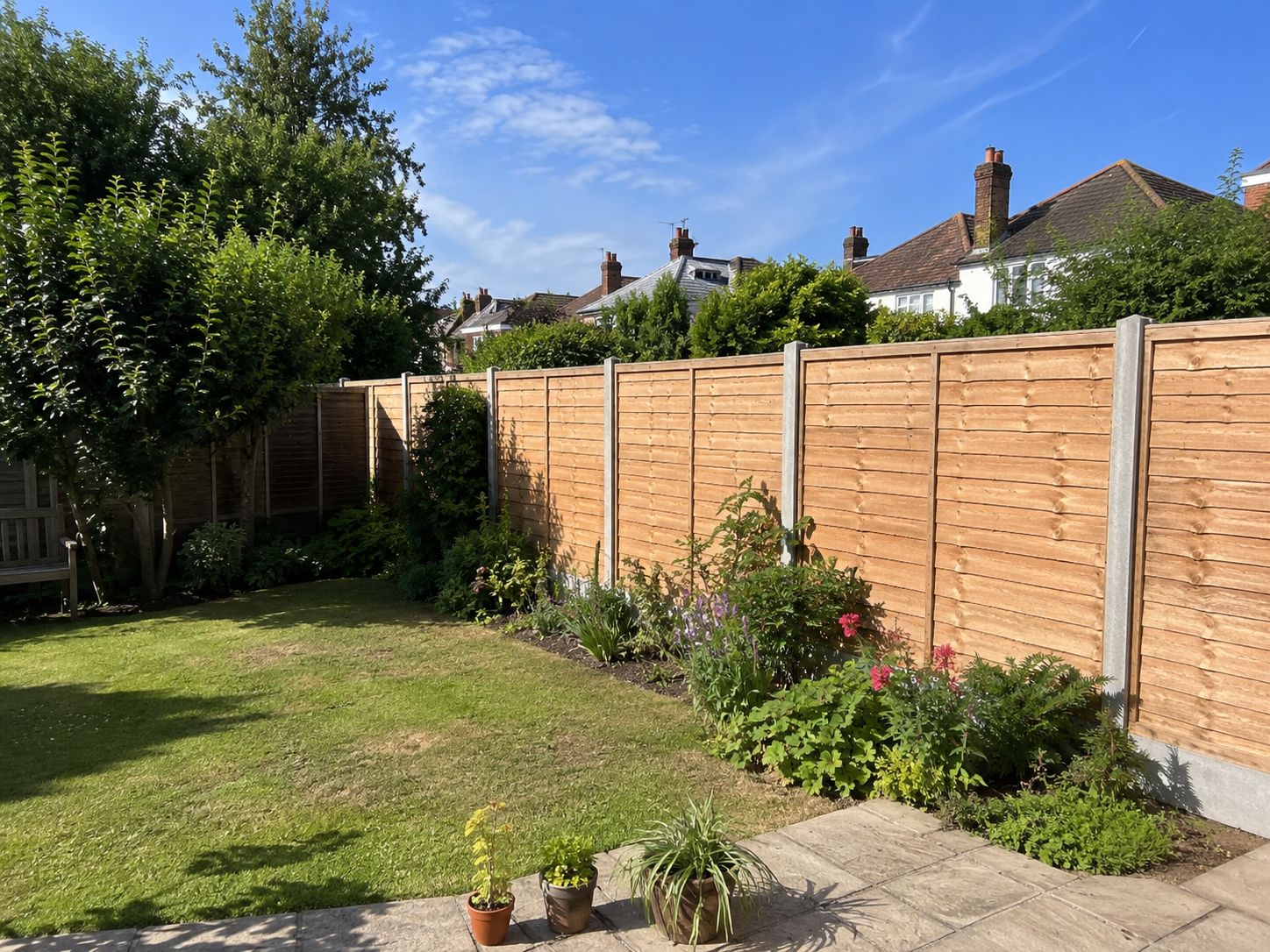 Closeboard timber garden fence with concrete posts installed in a Bromley back garden