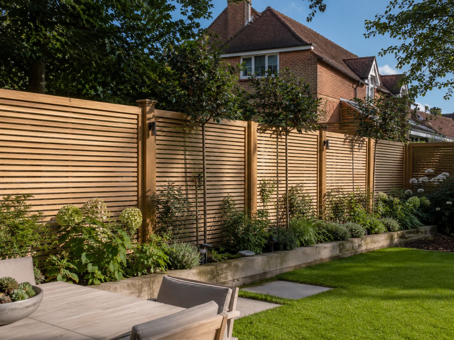 Slatted timber fence panels installed in a Fulham back garden