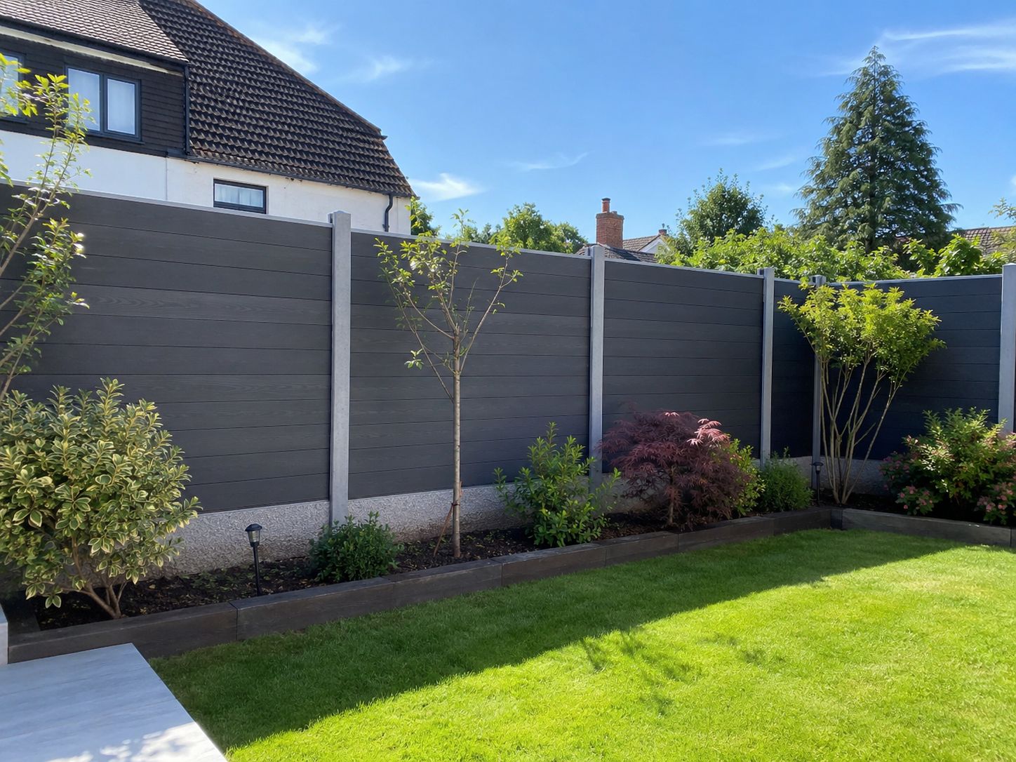 Composite fence panels fitted to a Watford back-garden boundary