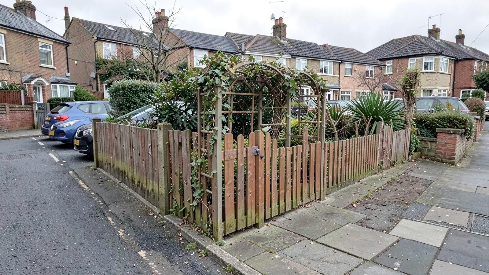 Low front garden fence beside a residential road in South West London